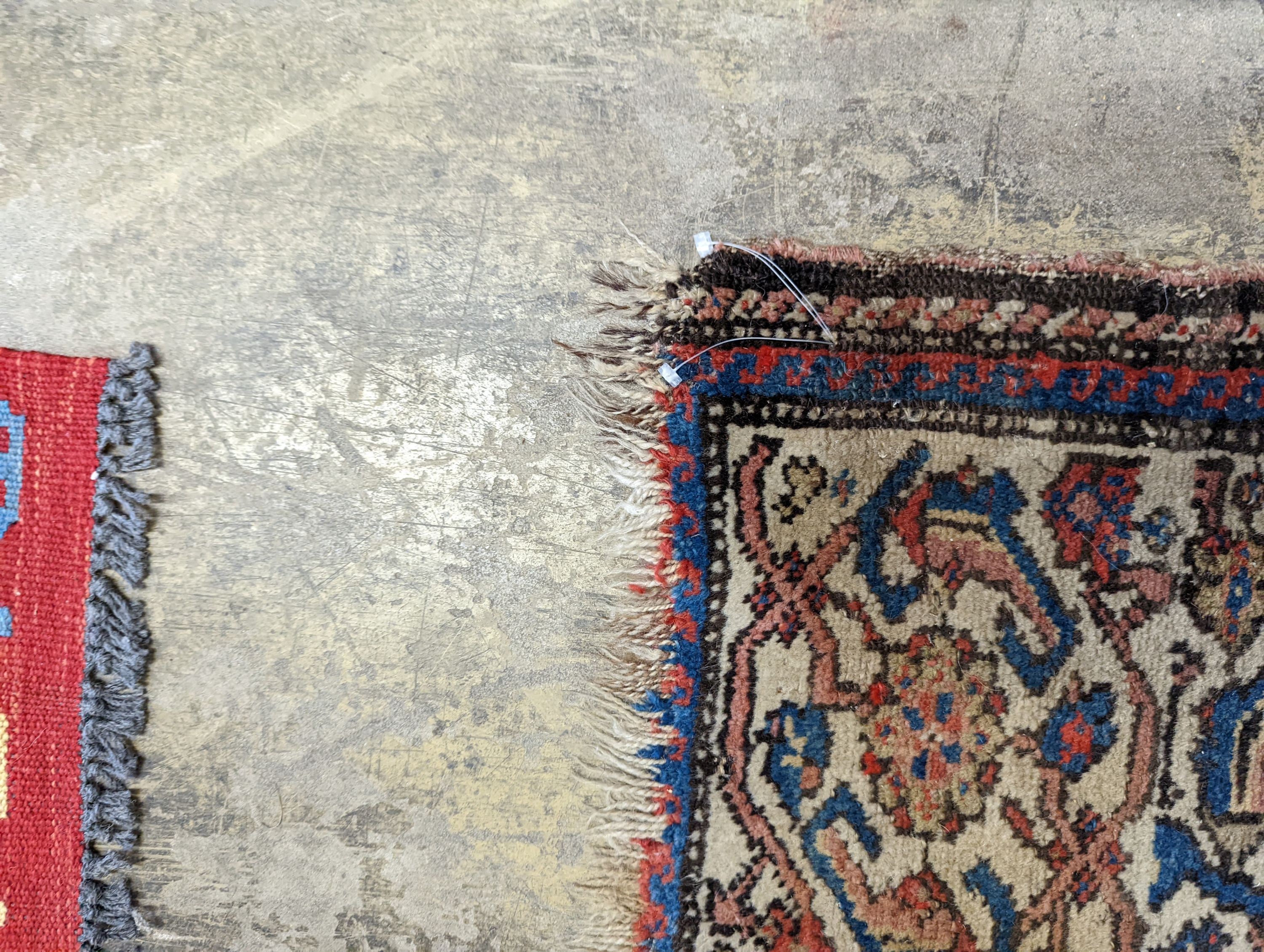 A Persian black ground runner, the central field including boteh motifs, 280 x 106cm, worn